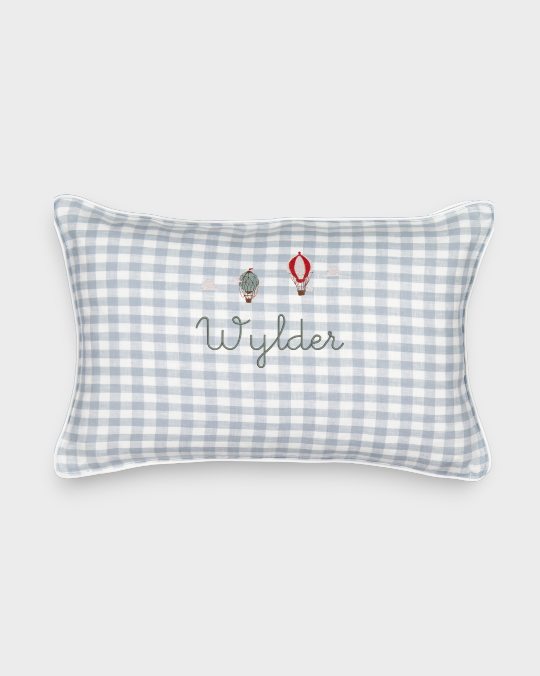 Duck egg blue linen cushion with embroidered vintage hot air balloons and personalized name on checkered fabric