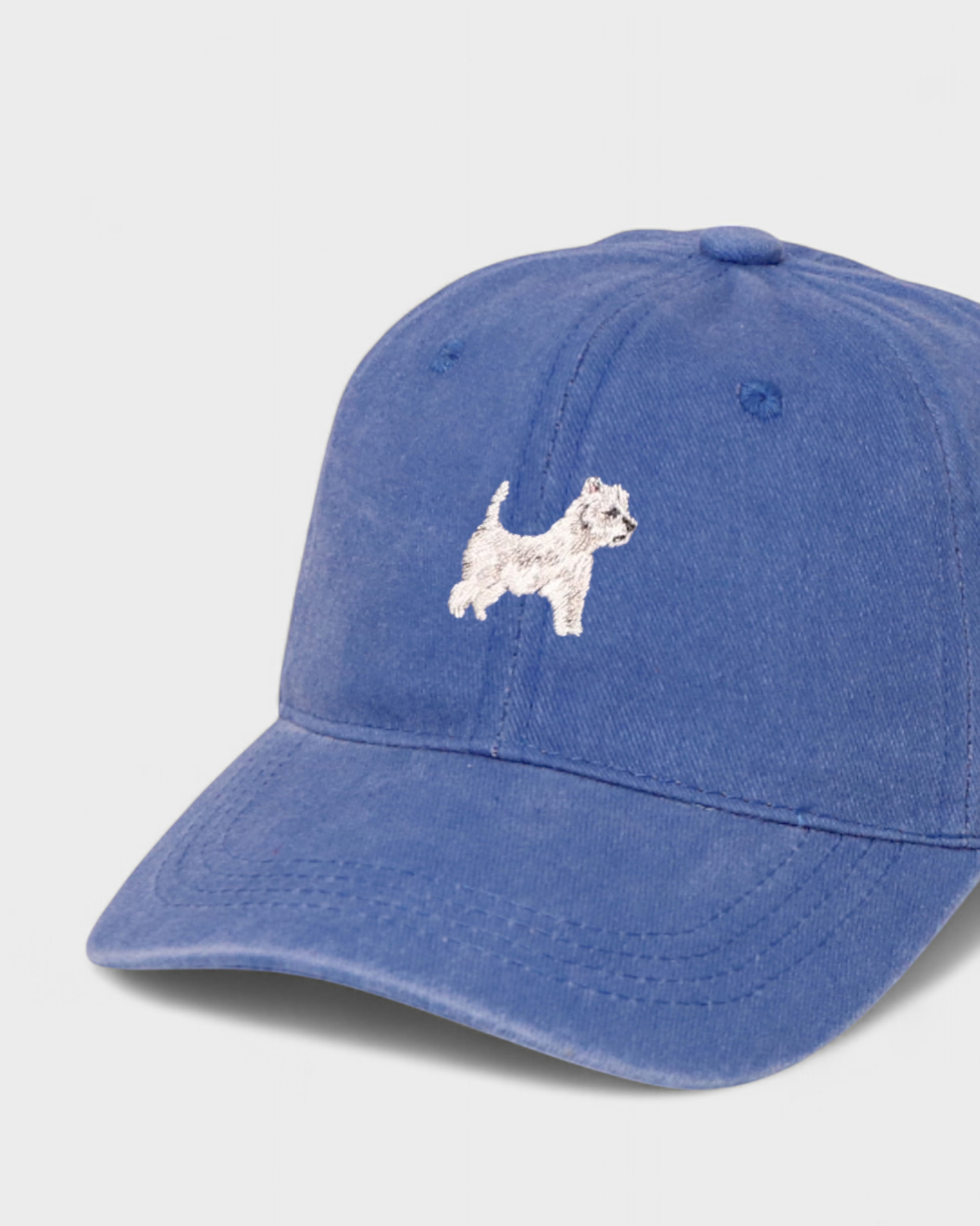 Blue personalised hat with embroidered West Highland White Terrier design on front