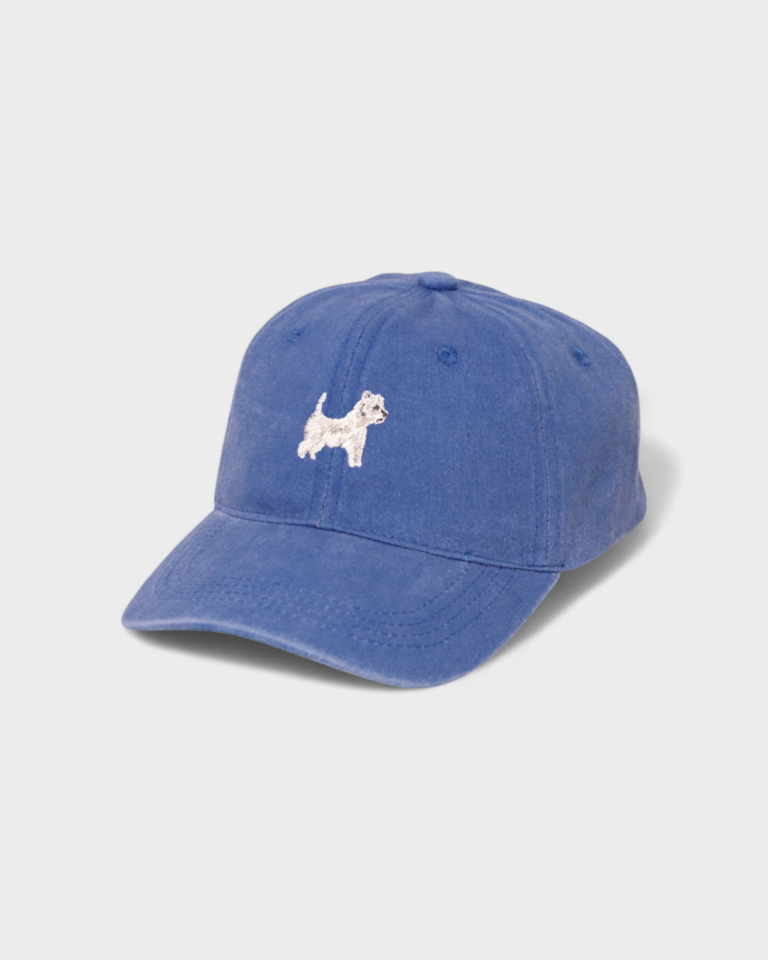 Blue personalised hat with embroidered white West Highland Terrier design on front, classic baseball style made of 100% washed cotton.