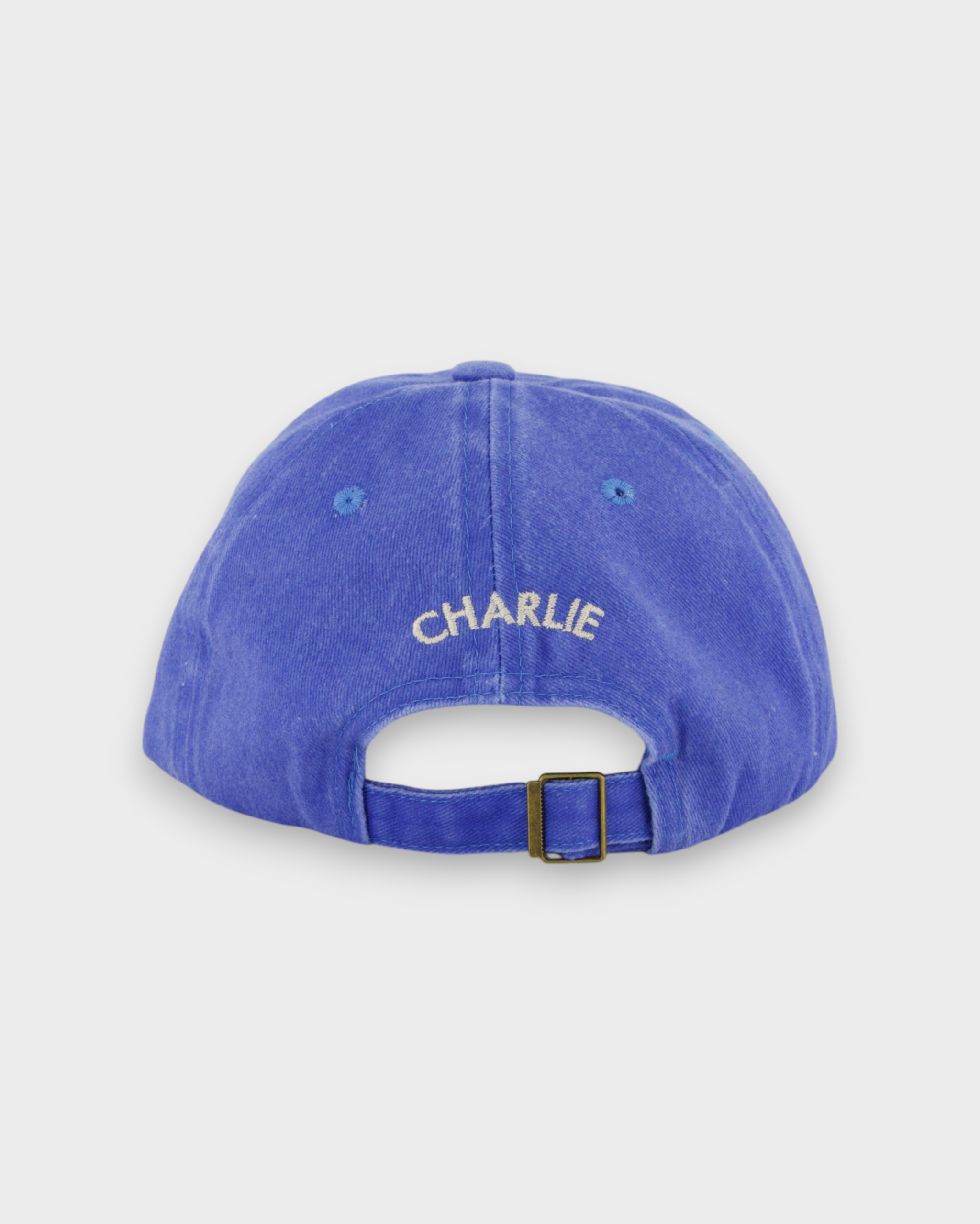 Personalised blue hat with custom embroidery on the back.