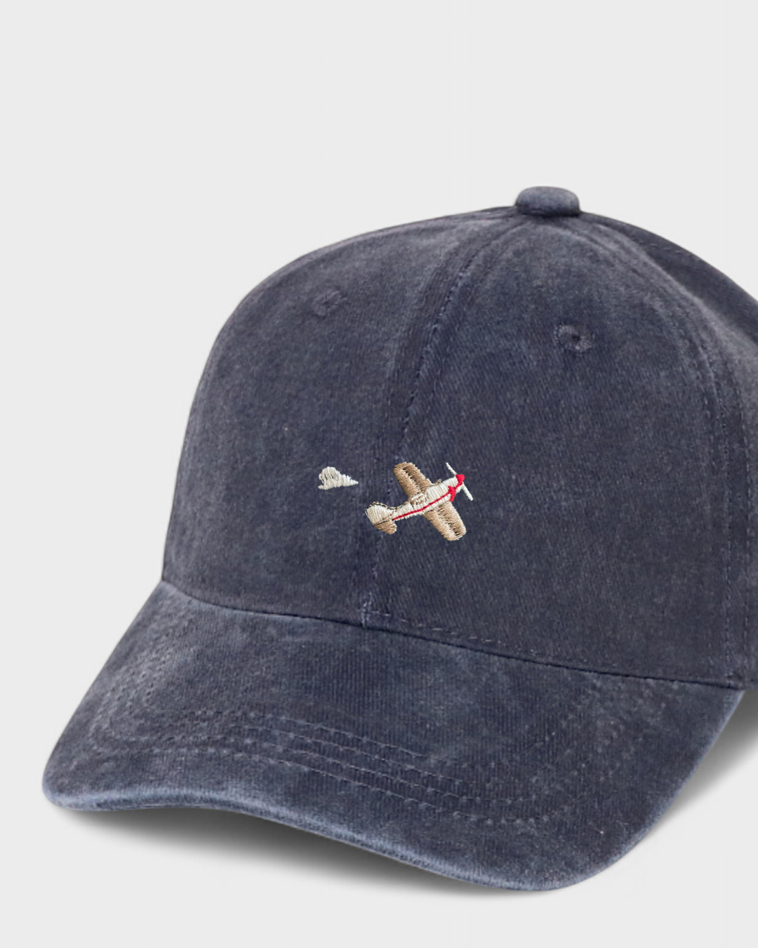 Airplane embroidered personalised hat in navy washed cotton baseball style.