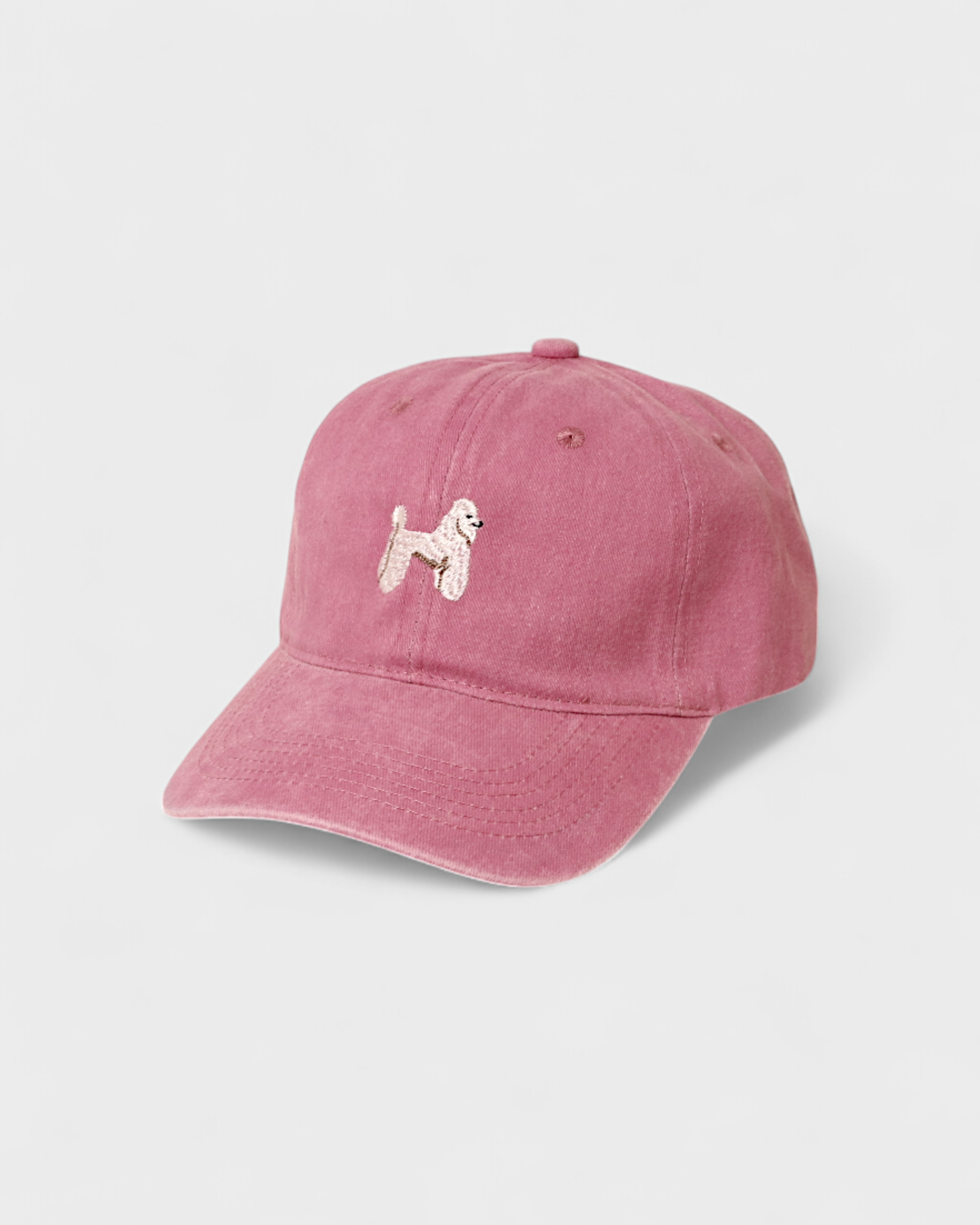 Pink Poodle Personalised Hat with embroidered hand-drawn poodle design on front, made of 100% washed cotton in classic baseball style.