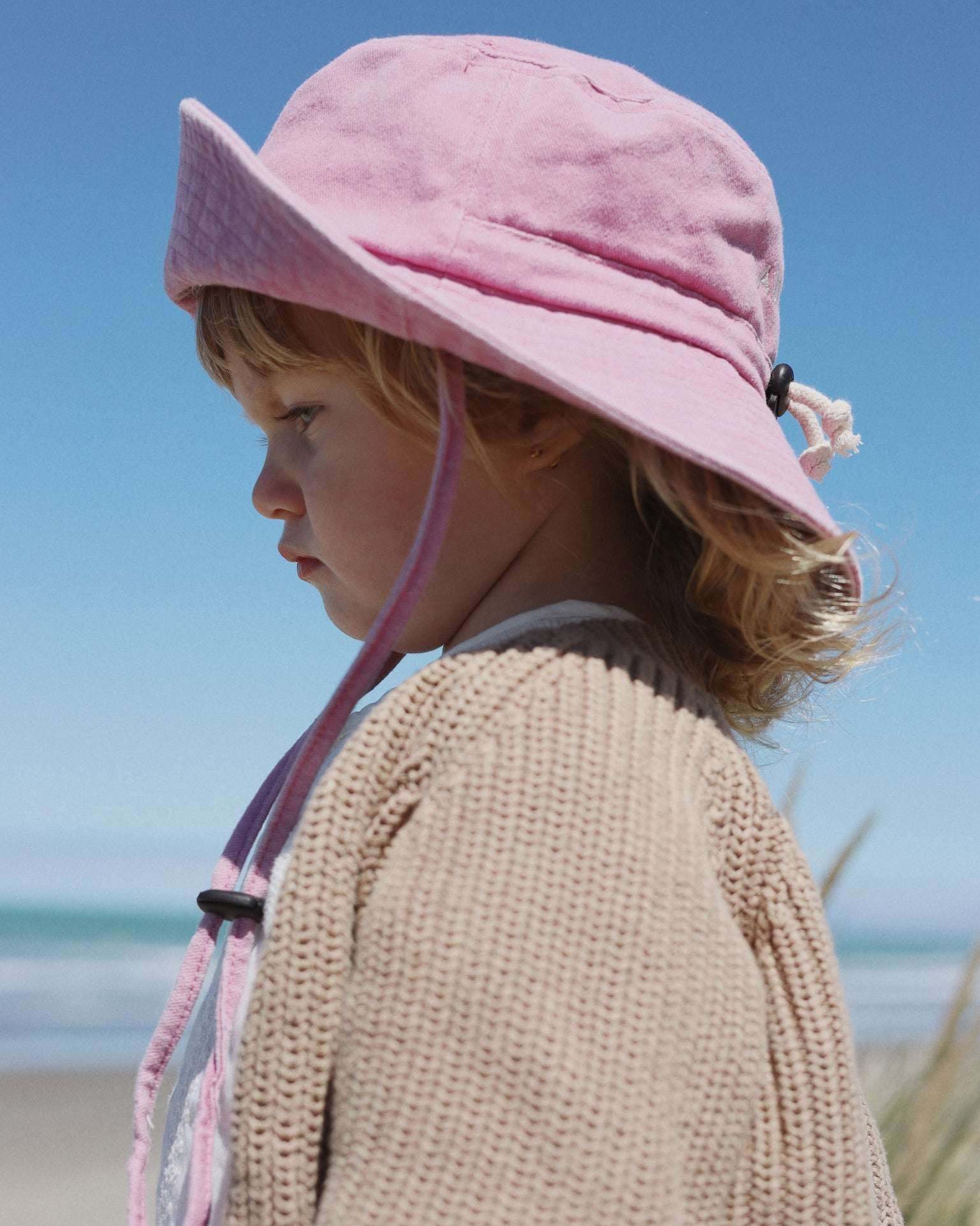 Pink Ferrari personalised bucket hat made of soft washed cotton for children aged 2-6 years, featuring adjustable chin strap and embroidered design.