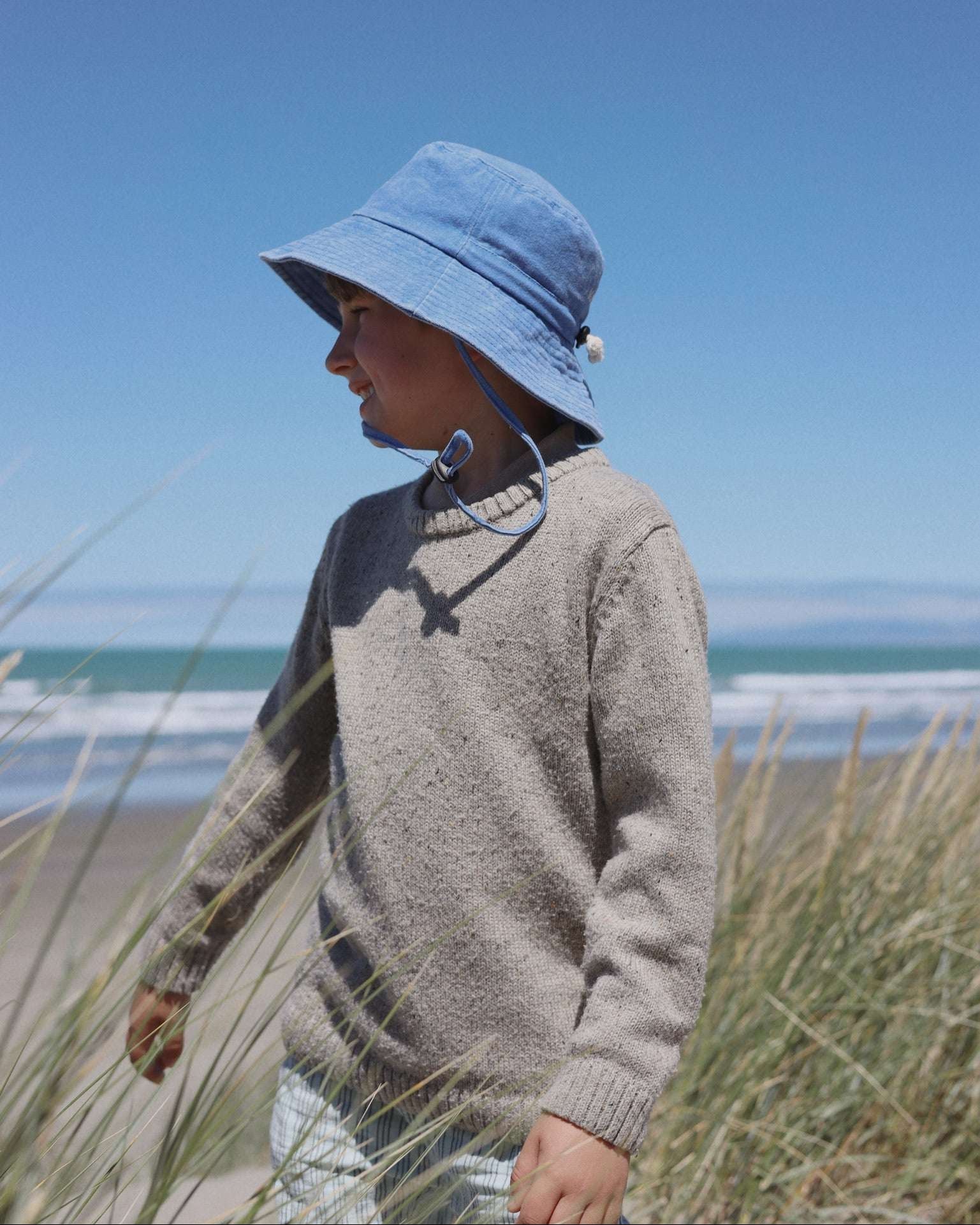 Customised blue bucket hat for kids made of 100% washed cotton.