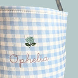 Personalised Easter Bucket with hand-drawn hydrangea embroidery on blue gingham design.