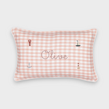 Nautical cushion with pink gingham linen, embroidered sea-themed designs, and personalized name "Olive"