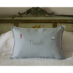 Duck egg blue gingham linen nautical cushion with embroidered sea-themed designs and personalized name Noah.