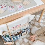 Blue gingham personalised chair bag on a children's chair with embroidery, ideal for organized learning spaces.