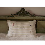 Nautical cushion with duck egg blue gingham linen, embroidered sea-themed designs and personalized name "Noah"