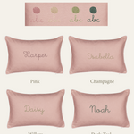 Personalized pink linen cushion options with embroidered names in various thread colors including pink, champagne, willow, and dark teal.