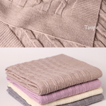 Merino baby blanket with rosette design and embroidery in soft wool.