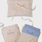 Merino baby blanket with rosette design in personalized embroidery.