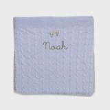 Merino baby blanket with balloon design and personalized embroidery.