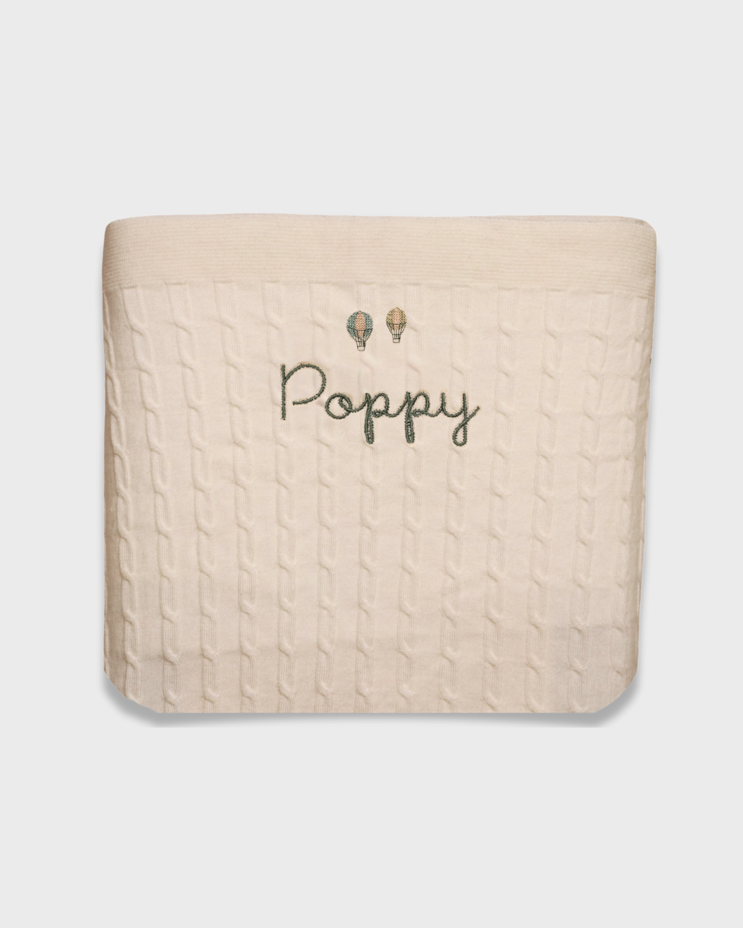 Merino baby blanket with personalized embroidery and vintage hot air balloon design.