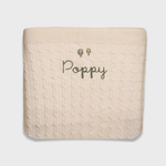 Merino baby blanket with personalized embroidery and vintage hot air balloon design.