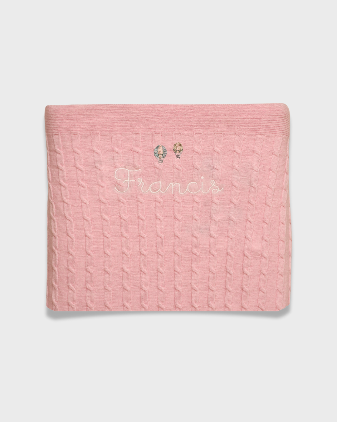Merino baby blanket with balloons design and personalized embroidery.