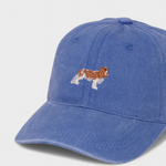 Blue baseball hat with embroidered King Charles Spaniel design, personalized embroidery on the back, made of 100% washed cotton.