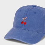 Blue personalised hat with embroidered cherries and pink bow design.
