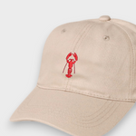 Personalised beige baseball hat with red lobster embroidery on front made of 100% washed cotton
