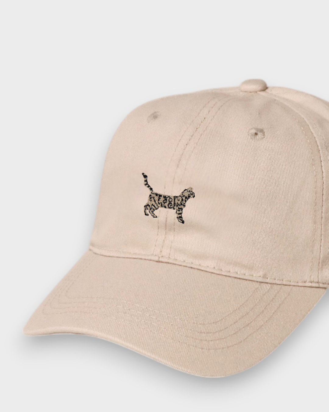 Beige personalised hat with embroidered Bengal cat design on front, made of 100% washed cotton in classic baseball fit