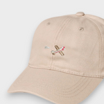 Beige 100% cotton baseball cap with embroidered airplane design, personalized text option, available in kids and adult sizes.