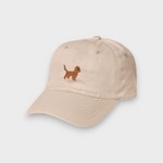 Beige baseball hat with embroidered brown Cocker Spaniel design on the front, made of 100% washed cotton, personalized embroidery option available.
