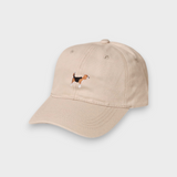 Beige baseball cap with hand-drawn embroidered Beagle design on front, personalised embroidery on back, made of 100% washed cotton.