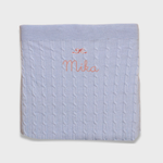 Merino baby blanket with bow design and personalized embroidery.
