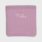 Merino baby blanket with bow design and embroidered personalisation.
