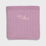 Merino baby blanket with bow design and embroidered personalisation.
