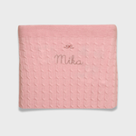 Merino baby blanket with bow design embroidery, soft and breathable wool.
