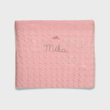 Merino baby blanket with bow design embroidery, soft and breathable wool.
