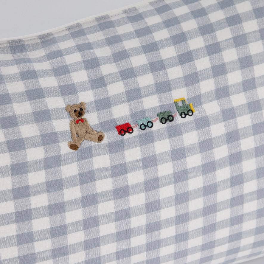 Choo Choo Train Linen Cushion with teddy and train embroidery on checkered fabric.