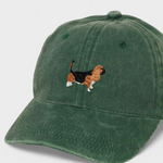 Green baseball cap with embroidered hand-drawn Basset Hound design, personalized back embroidery option, made of 100% washed cotton.