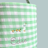 Personalised Easter Bucket with hand-drawn Mother Goose embroidery on green gingham pattern.