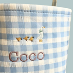 Personalised Easter Bucket with gingham pattern and hand-drawn goose embroidery design.