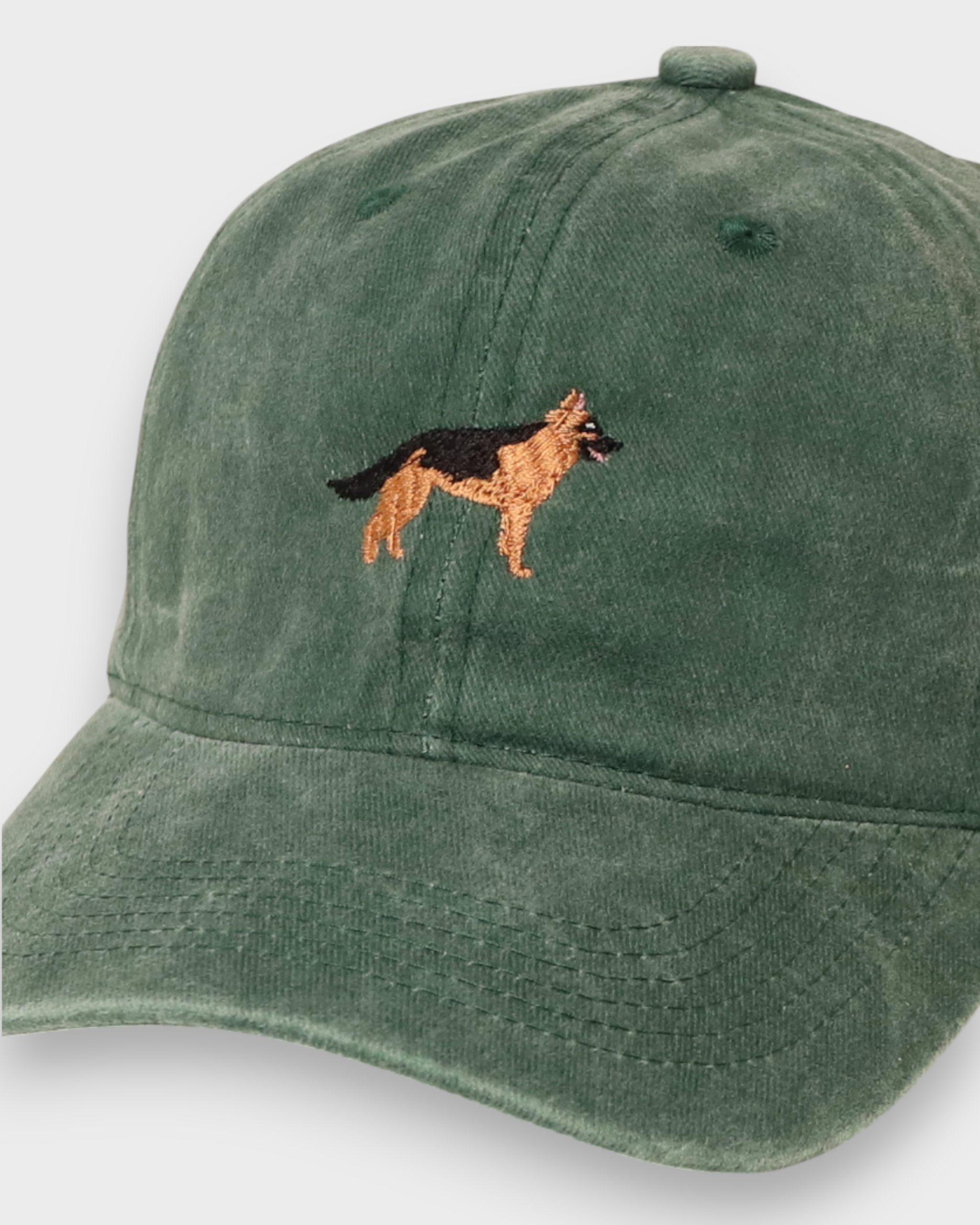 German Shepherd personalised hat with embroidered design on green cotton fabric.