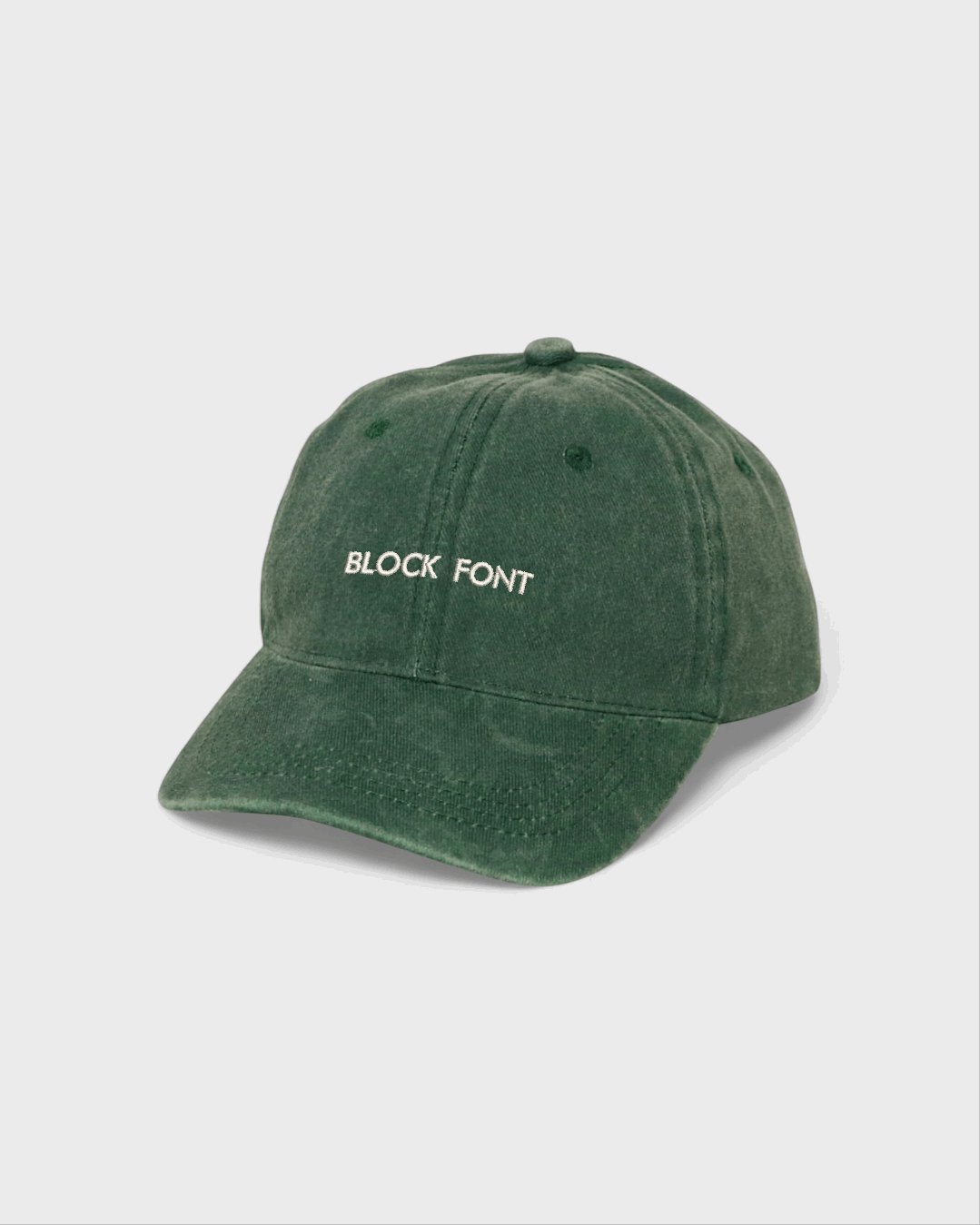 Personalised hat with block font on green cotton baseball cap.