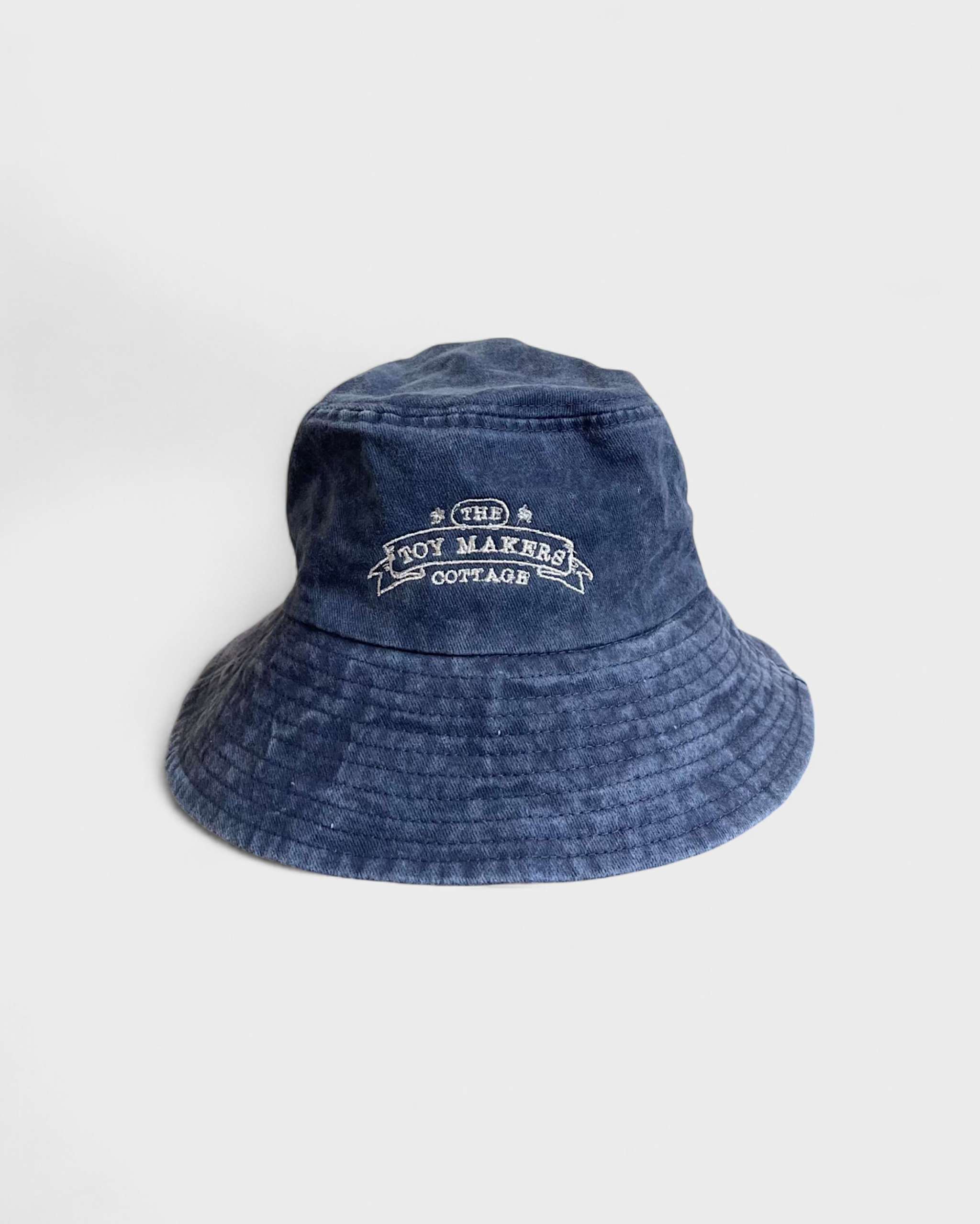 TMC Personalised Bucket Hat made of blue washed cotton with embroidered logo.