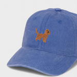 Blue baseball hat with embroidered brown Cocker Spaniel design and personalized embroidery option on the back