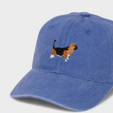 Blue baseball cap with embroidered hand-drawn Basset Hound design, personalised embroidery option on the back, made of 100% washed cotton.