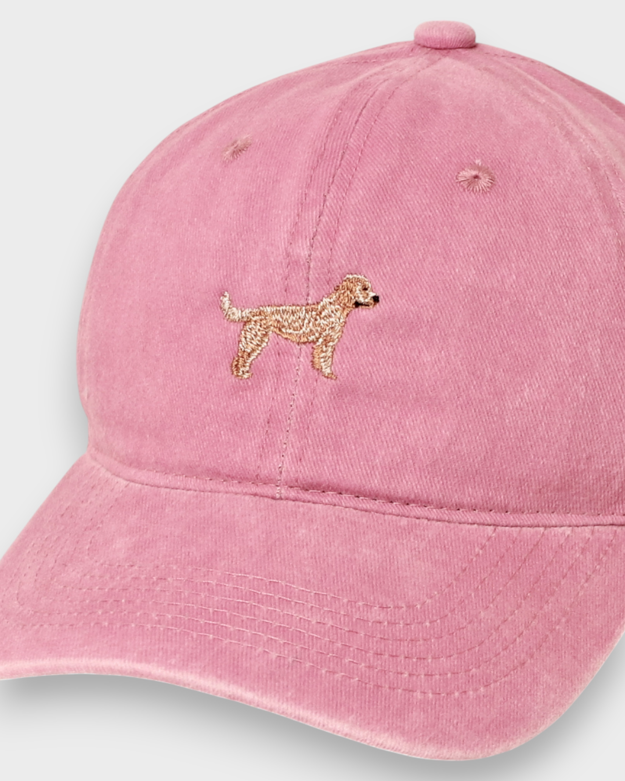 Labradoodle personalised hat with embroidered design on pink washed cotton.