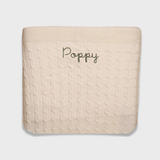 Merino baby blanket with personalized embroidery in soft wool fabric.