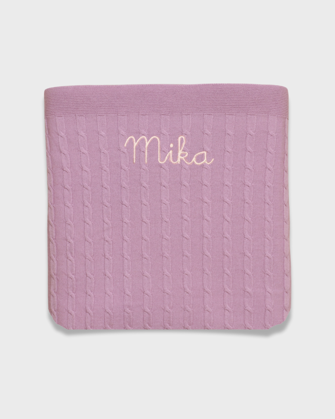 Merino baby blanket with embroidered name, soft wool, pink color.