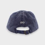 Airplane personalised hat with adjustable strap and custom embroidered name "LEO" on the back, made from 100% washed cotton.