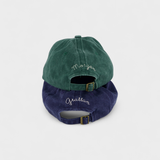 Airplane personalised hat in green and blue with custom embroidery on the back.