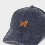 Navy blue baseball hat with embroidered Cocker Spaniel design on front and personalized embroidery on back