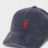 Navy blue personalised hat with red lobster embroidery and customisable back embroidery in block or script font