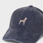 Navy blue baseball hat with embroidered hand-drawn Dalmatian design on front, personalised embroidery option on back, made of 100% washed cotton.