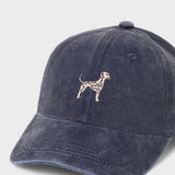 Navy blue baseball hat with embroidered hand-drawn Dalmatian design on front, personalised embroidery option on back, made of 100% washed cotton.